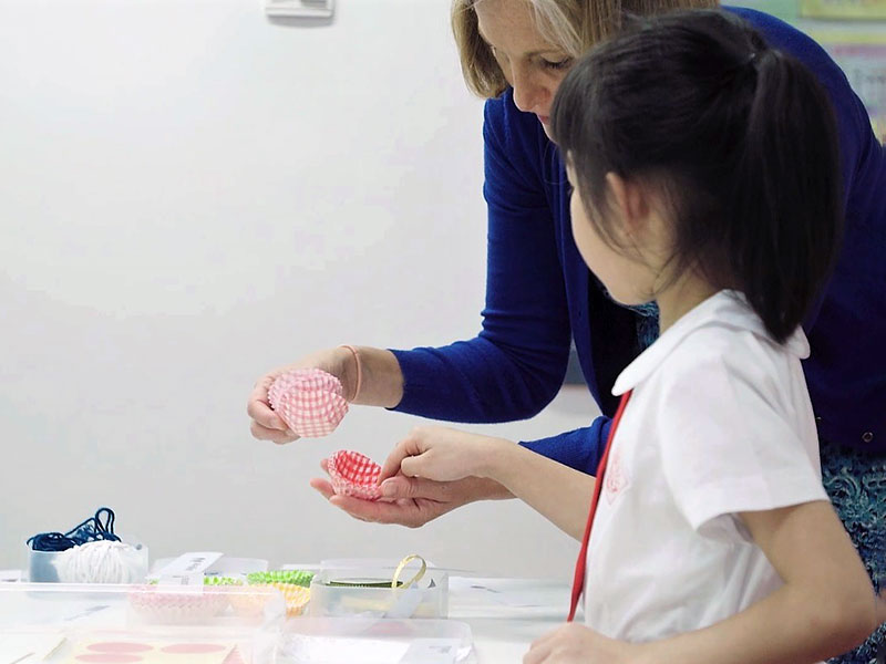 "English teacher speaking with Chinese student"